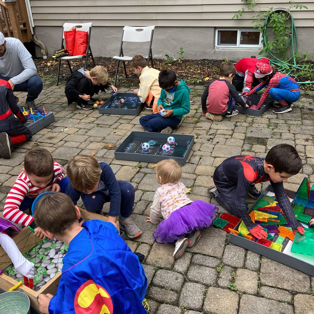 Superheros Working On Puzzle Boxes